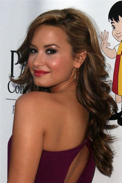 Demi Lovato Wavy Light Brown Pinned Back Side Part Hairstyle Steal
