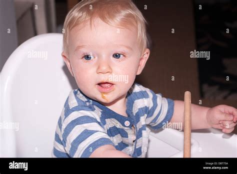 6 Month Old Baby Boy With Food Round His Mouth Stock Photo Alamy