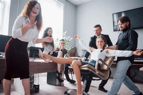 A Group Of Business People Celebrating Having Fun At The Office Stock Image Image Of