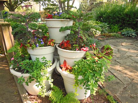 Your container vegetable garden may look incomplete if you don't grow some herbs. Container Garden Tower Pyramid - How To Build It ⋆ Shawna ...