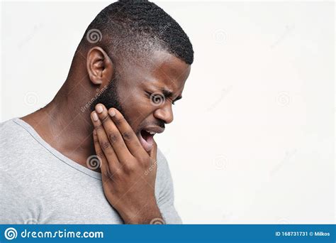 Young Man Having Acute Toothache Holding His Jaw Stock Image Image