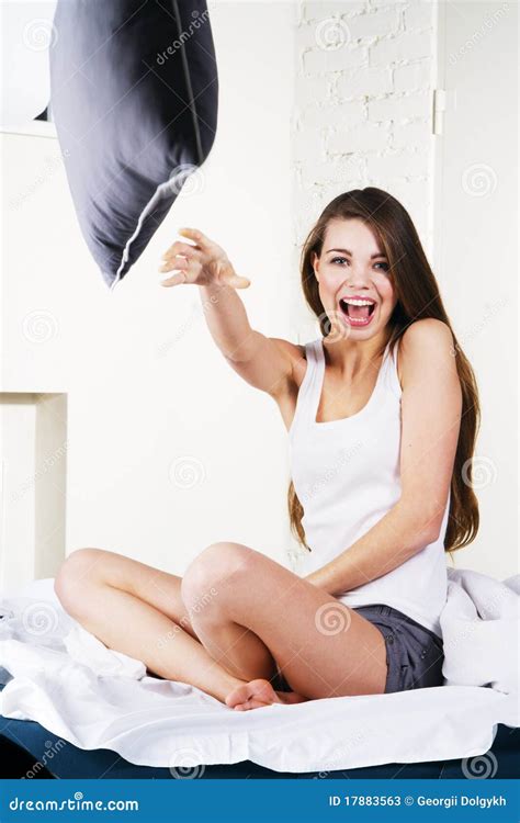 Beautiful Woman Throwing A Pillow Stock Image Image Of Eyes