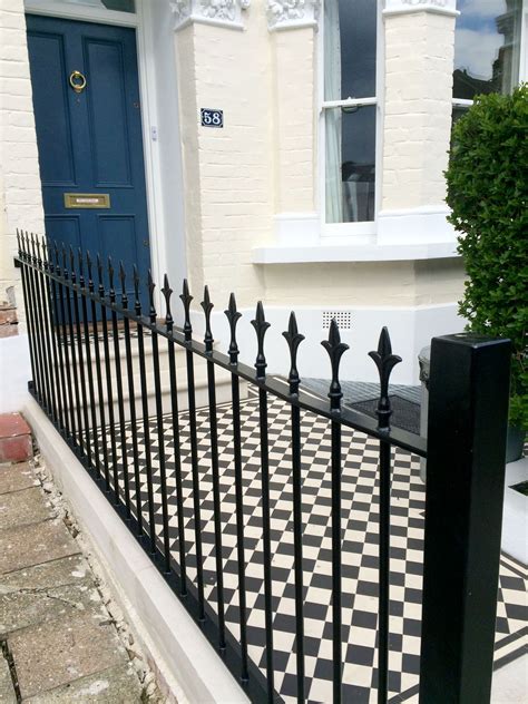 Traditional Cast Iron Black Railings And Tiled Mosaic Pathway In