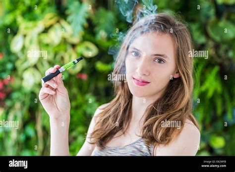 Woman Smoking Electronic Cigarette Stock Photo Alamy