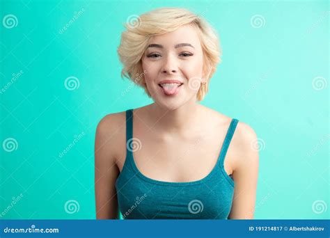 Portrait Of Happy Blonde Woman With Tongue Sticking Out Looking Stock Image Image Of Beauty