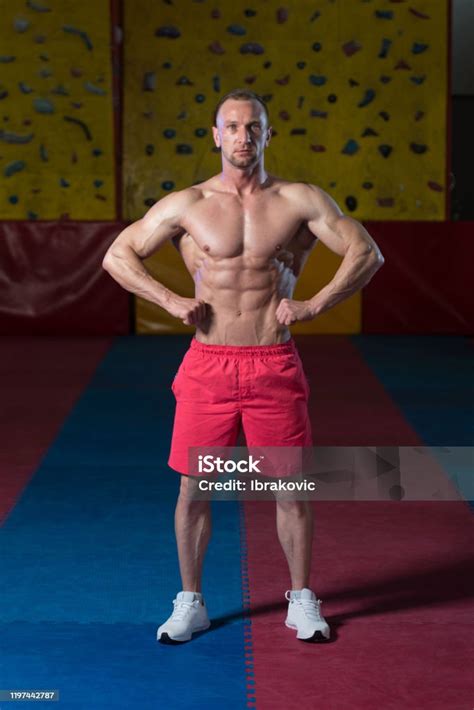 Muscular Body Builder Showing His Front Lat Spread Stock Photo