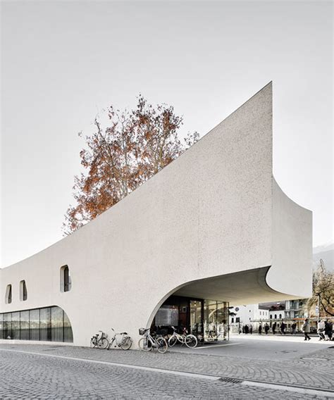 curved concrete wraps modus architects' 'treehugger' tourist office in
