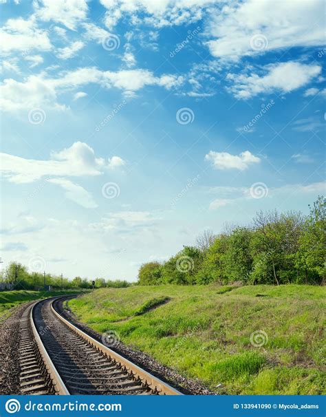 Railroad To Horizon In Blue Sky With Clouds Stock Photo Image Of