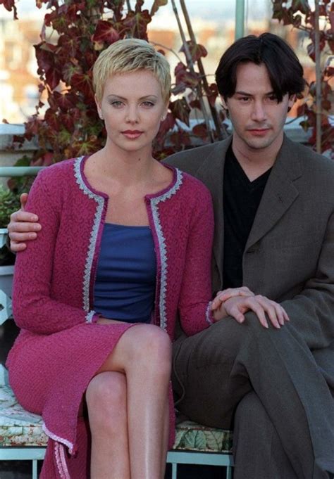 Keanu Reeves With Co Star Charlize Theron At Photo Call For Film Keanu Reeves Charlize