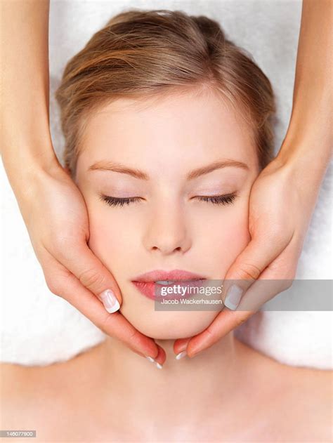 Closeup Of Young Woman Receiving Facial Massage At Day Spa High Res