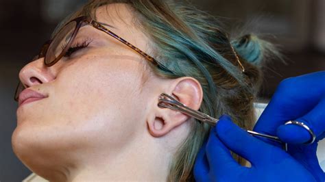 here s why you should think twice about piercing your own ears