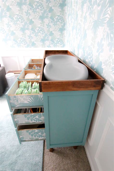 Using a circular saw, cut the lines to lop off the corners of the table and create an octagon. DIY Changing Table Topper