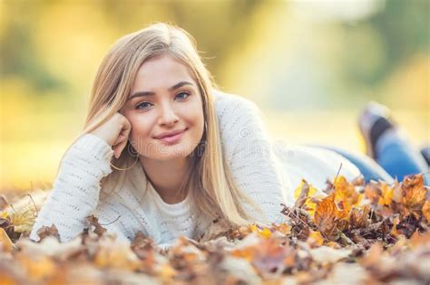 Autumn Portrait Of Young Woman Lying On Maple Leaves In Park Stock Image Image Of Beautiful