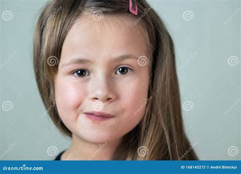 Close Up Portrait Of Little Child Girl With Funny Face Expression Stock
