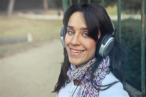 Young Woman Wearing Scarf Using Headphones Listen Music Piqsels