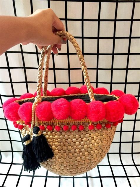 This Delightful Multi Colored Pom Pom Straw Bag Makes The Ultimate