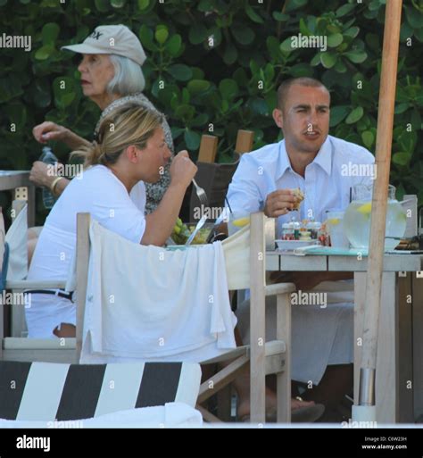 Fabio Cannavaro And Wife Daniela Cannavaro At Their Hotel While Taking