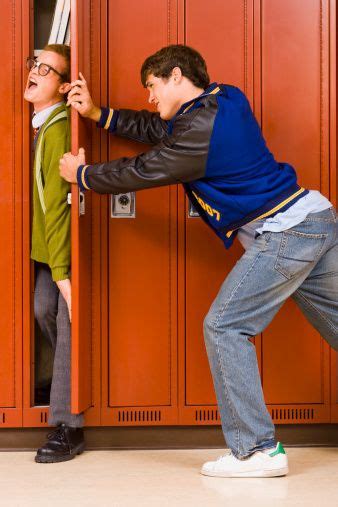 portrait of a nerdy guy getting dunked in the school toilet jock high school stereotypes