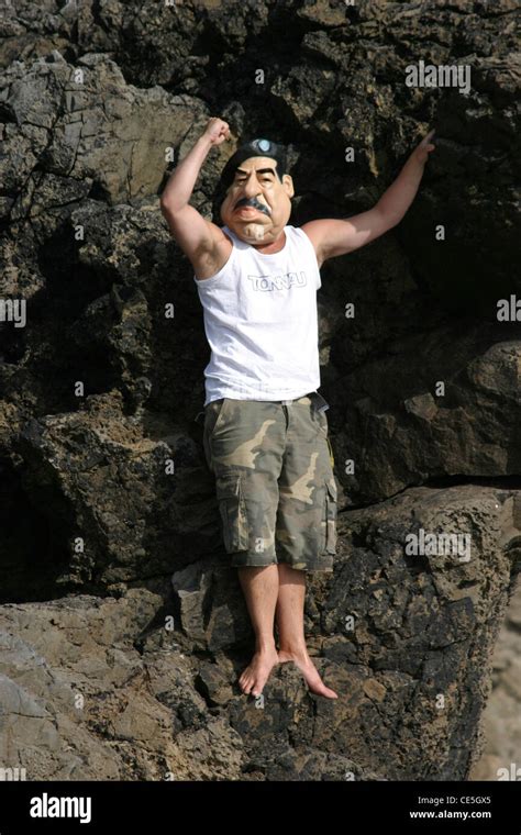 Saddam Hussein Hiding In A Cave Hanging Onto Rocks Stock Photo Alamy