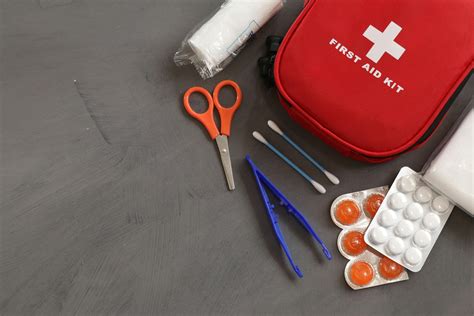 First Aid Kit On Gray Background · Free Stock Photo