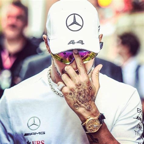 Hamilton has a dkh tattoo on his arm, which are his brother's initials. Lewis Hamilton Tattoo Hand
