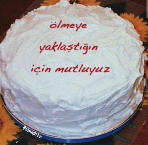 A Cake With White Frosting And Red Writing On It
