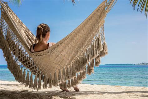 Beach Vacation Holidays With Woman Relaxing In Hammock Between Coconut