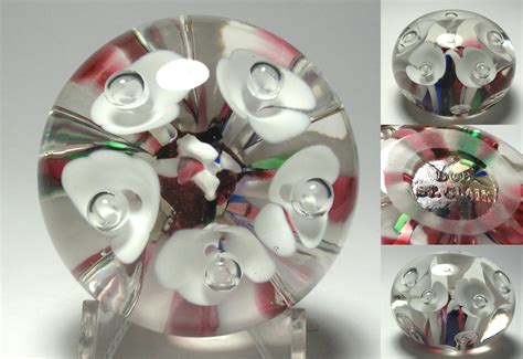 You make the decorations and sculptures inside the paperweight with smaller lamps and tools also used to make glass beads. St. Clair Paperweights for Sale