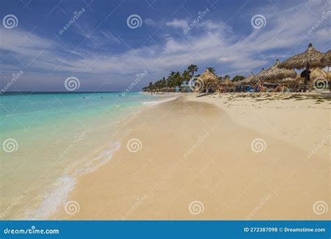 Beautiful View Of Atlantic Ocean With People Lying On Sun Loungers