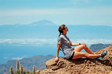 Woman Sitting On Top Of A Mountain Image Free Stock