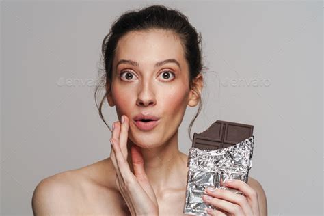 Surprised Half Naked Woman Posing With Chocolate On Camera Stock Photo