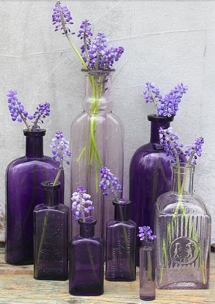Purple Glass Vases With Lavender Flowers In Them