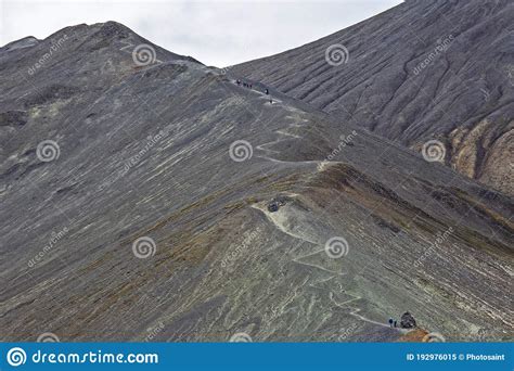 Tourists Pass On The Slope Of The Mountain Route In Landmannalaugar