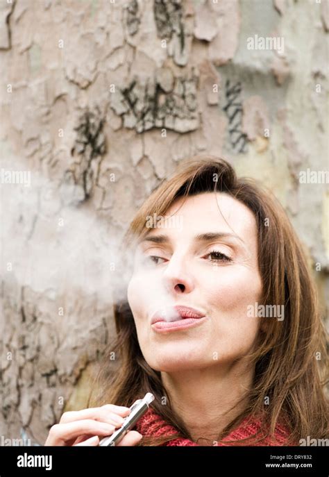 Mature Woman Smoking Cigarette Hi Res Stock Photography And Images Alamy