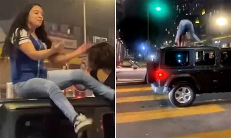 Moment Woman Twerking On The Roof Of A Jeep Gets Dropped On Her Head