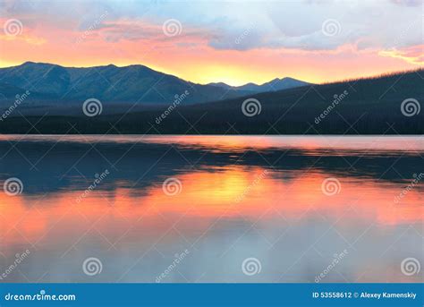 Beautiful Red Sunset Into The Mountains And Mcdonald Lake In Glacier
