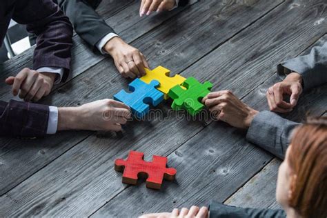 Business People Assembling Jigsaw Puzzle Stock Image Image Of