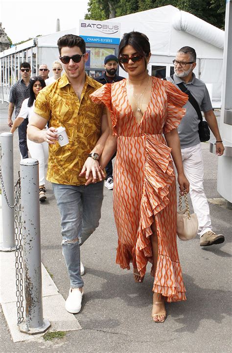 Priyanka Chopras Plunging Orange Dress And High Slit In Paris Pic Hollywood Life