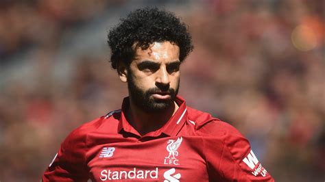 Mohamed salah celebrates with teammates after scoring the opening goal for liverpool during the second leg of the champions league against rb leipzig, 10/03/2021. Mohamed Salah scoops the Goal of the Month award