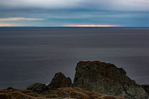 Rocky Atlantic Coastline Of Crow Head At Long Point Lighthouse