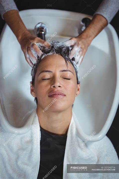 Woman Getting Her Hair Wash At Salon Profession Wash Basin Stock
