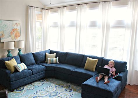 A large custom sectional and console table divide the family room from our client's kitchen and are punched up with bright accents and layered. carolina on my mind: Living Room Makeover: Part 5 (Navy ...
