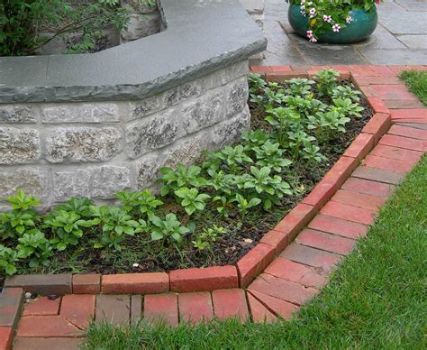 Paver edging options borders non steps restraints more. Brick edging mimics the wall | Brick landscape edging ...