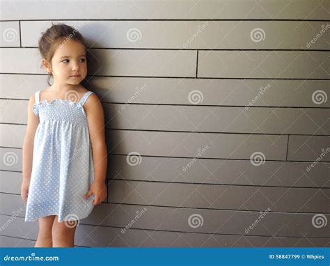 Little Girl Standing Over Modern Brick Stock Image Image Of Grey