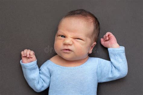 Newborn Baby Emotions White Background Funny Face Of A Child