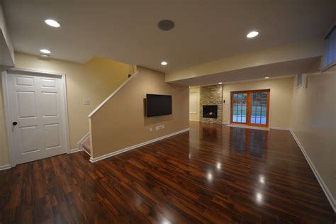 Epoxy floor coatings are good if you can live with a hard surface flooring. Basement Laminate Ideas| Basement Masters
