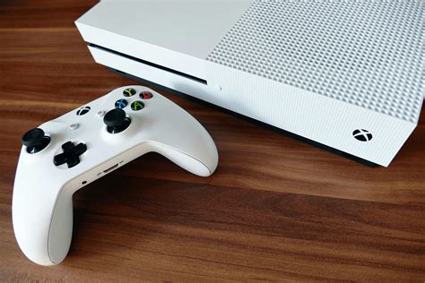 A Game Console On A Wooden Surface · Free Stock Photo