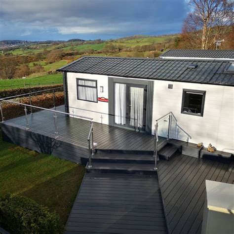 These charge themselves through the daylight and in the sun and then shine all night long! Dark Grey Composite Decking With Stainless Steel Balustade ...