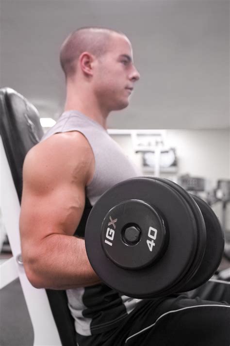 Men Exercise Free Stock Photo A Healthy Young Man Lifting Weights