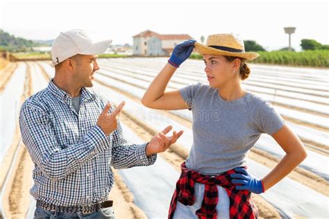 Man And Girl Farmers Talking Friendly In Field During Break In Work Stock Image Image Of Farm